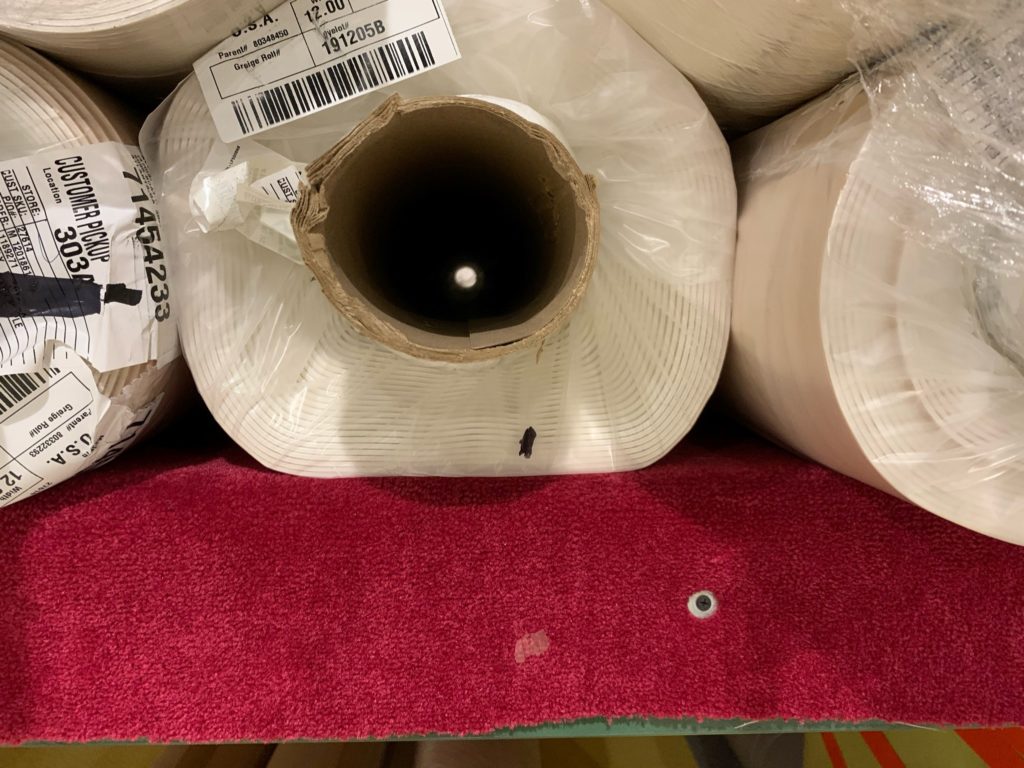 The Inside Track | Roll of vinyl wedged up against other rolls. 