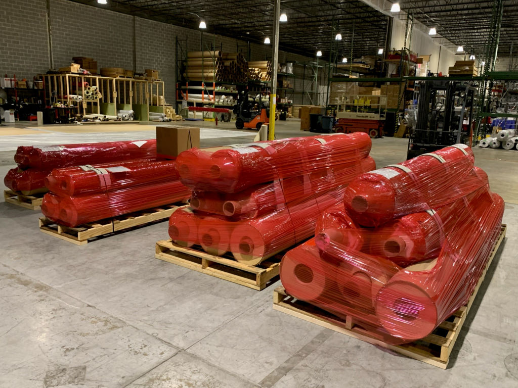 Our red-wrapped skids are easy to find on the show floor.