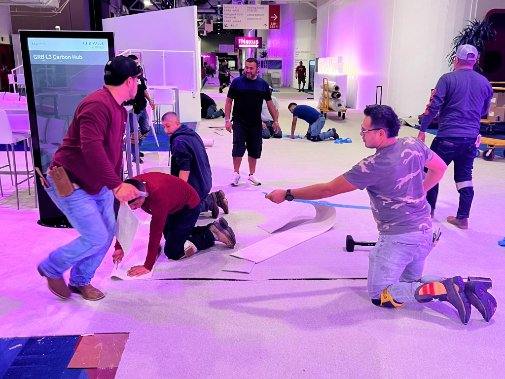 The Inside Track trade show flooring - example of install with full team - blog crop The Inside Track trade show flooring - example of install with full team - blog crop